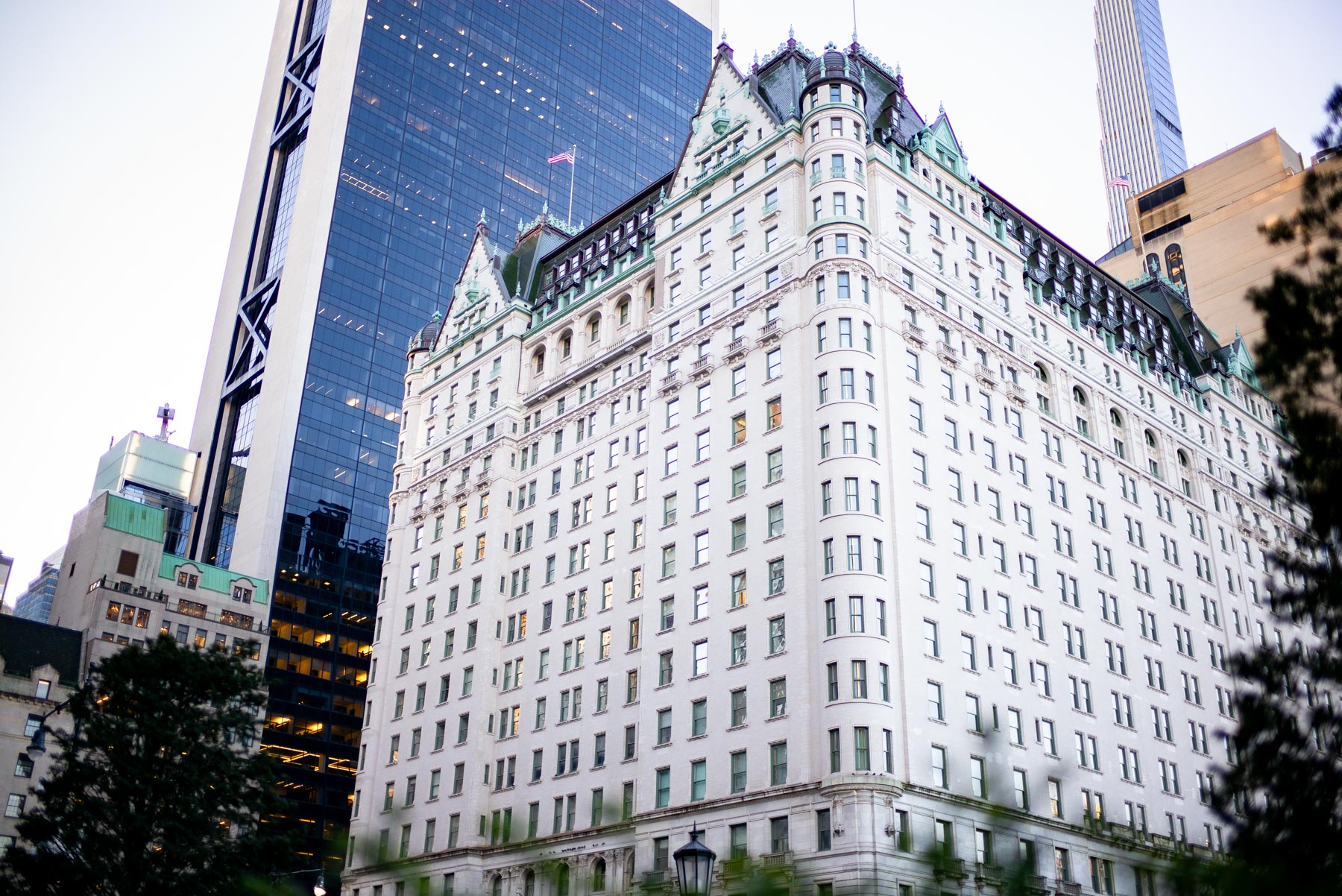 The Plaza Hotel rises above surrounding skyscrapers near Central Park.