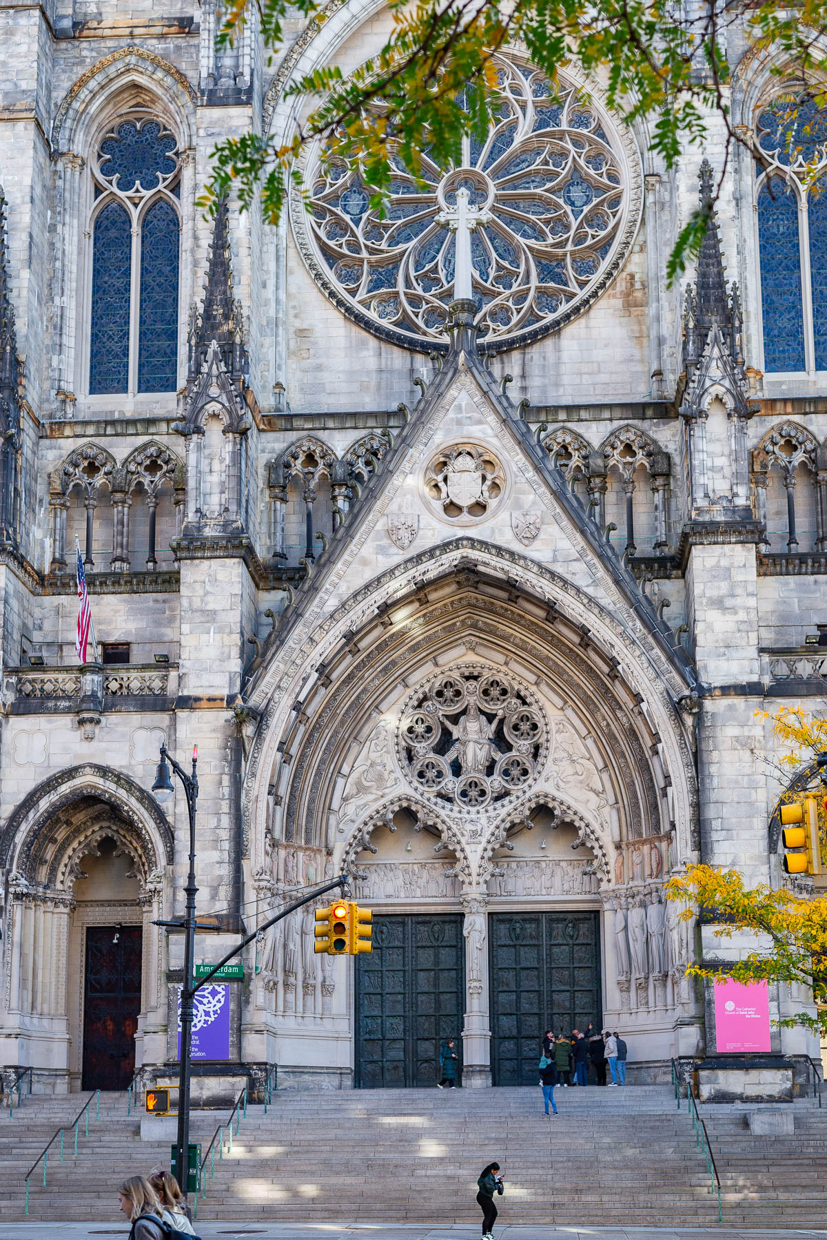 The Gothic facade of the Cathedral of St. John the Divine with its rose window and entrance doors.