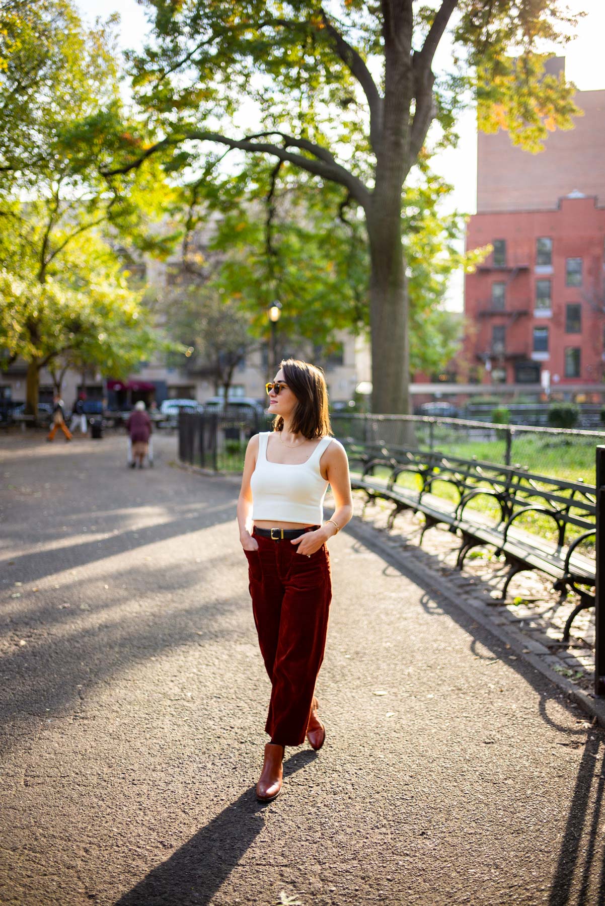 Woman walking in Tompkins Square Park 
Best things to do East Village NYC