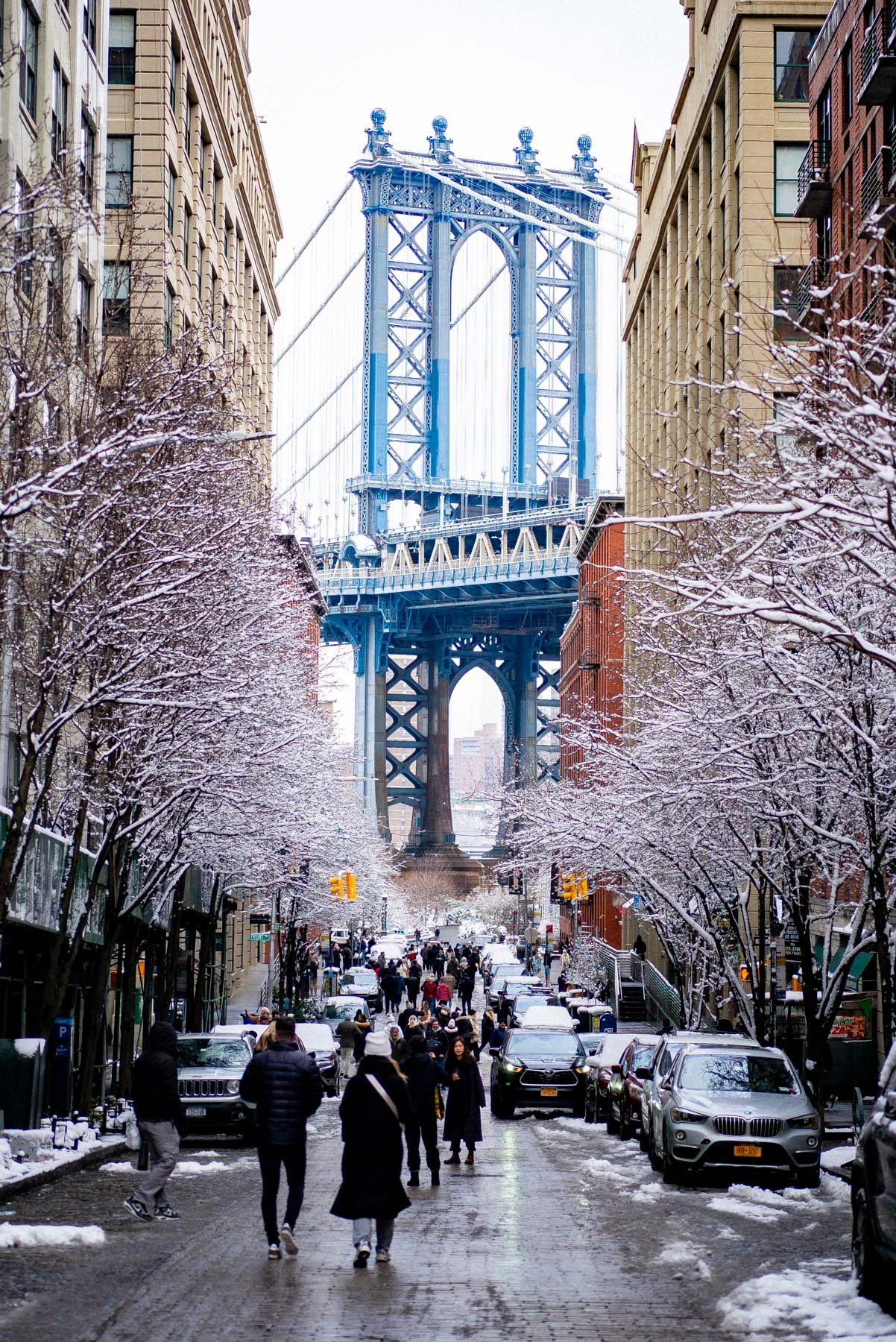 Snow-dusted Washington Street framed by the Manhattan Bridge in DUMBO.