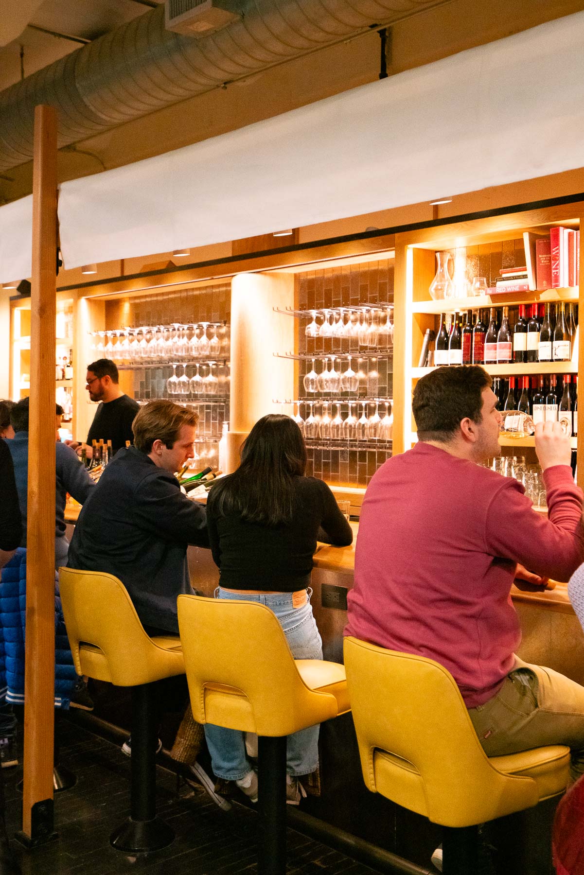 Couple enjoying some wine at Corkbuzz, one of the best things to do at the Chelsea Market Couple enjoying some wine at Corkbuzz, one of the best things to do at the Chelsea Market