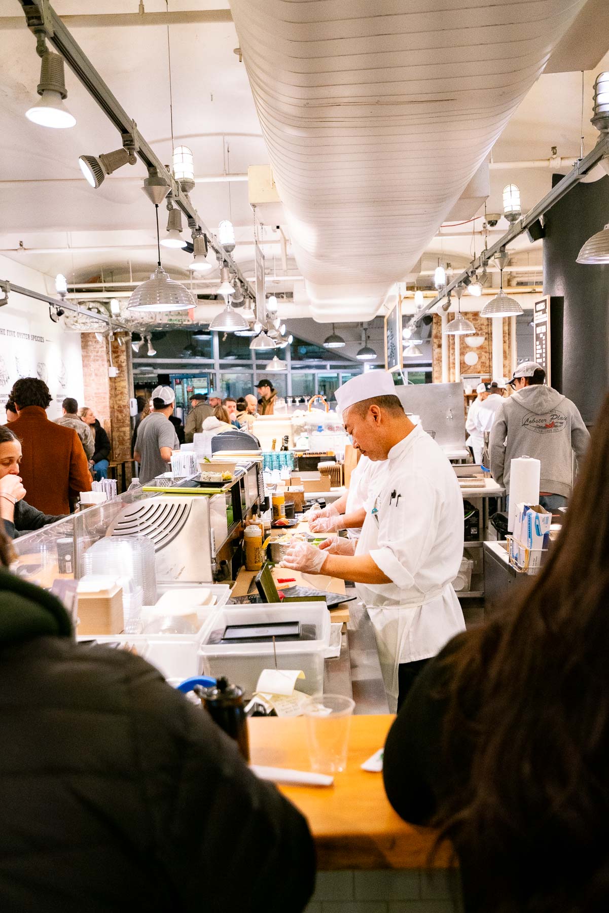 Sushi chef behind the counter at the Lobster Place, one of the best things to do Chelsea Market Sushi chef behind the counter at the Lobster Place, one of the best things to do Chelsea Market