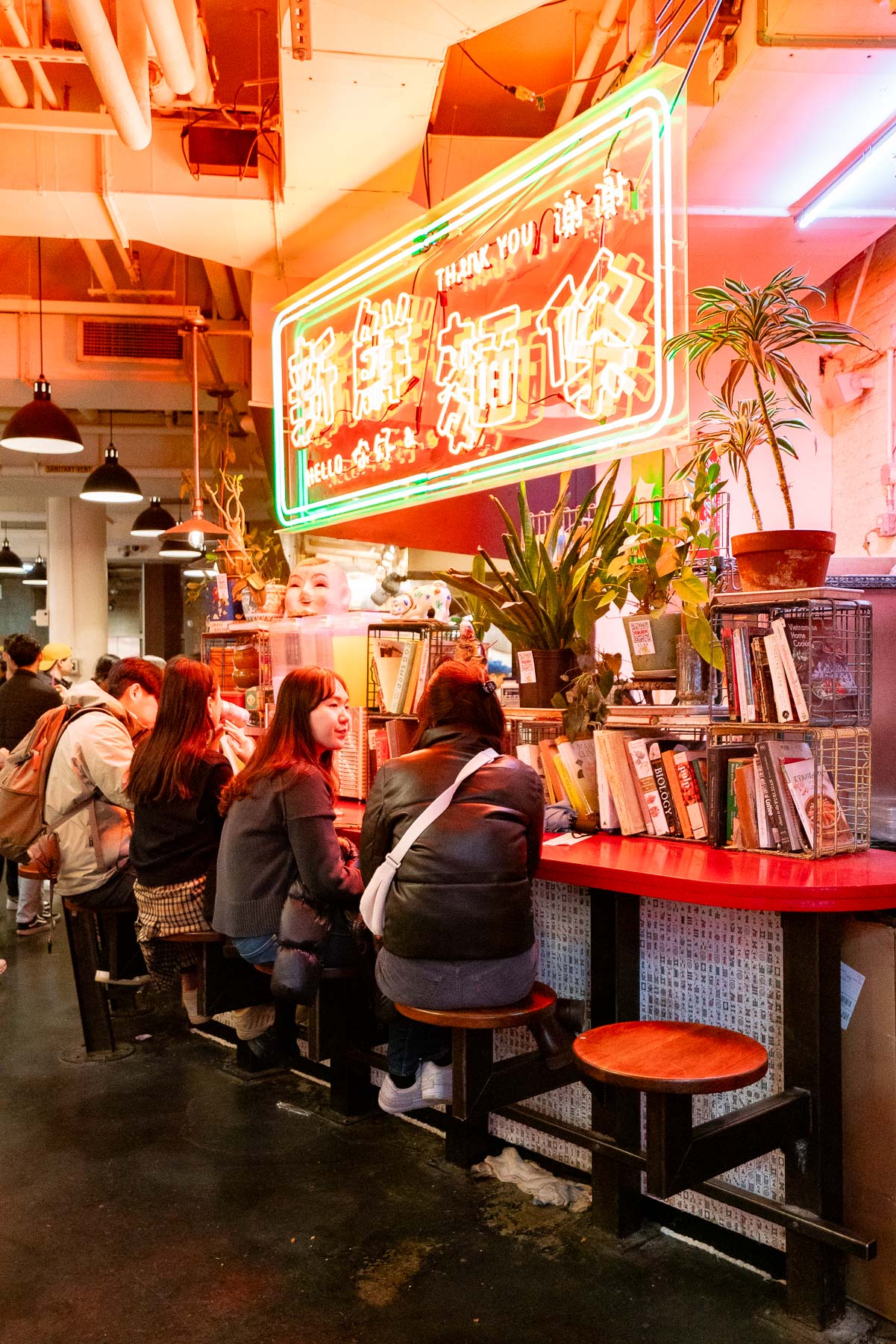 Friends hanging out and chatting while enjoying their Very Fresh Noodles, one of the best things to do Chelsea Market Friends hanging out and chatting while enjoying their Very Fresh Noodles, one of the best things to do Chelsea Market