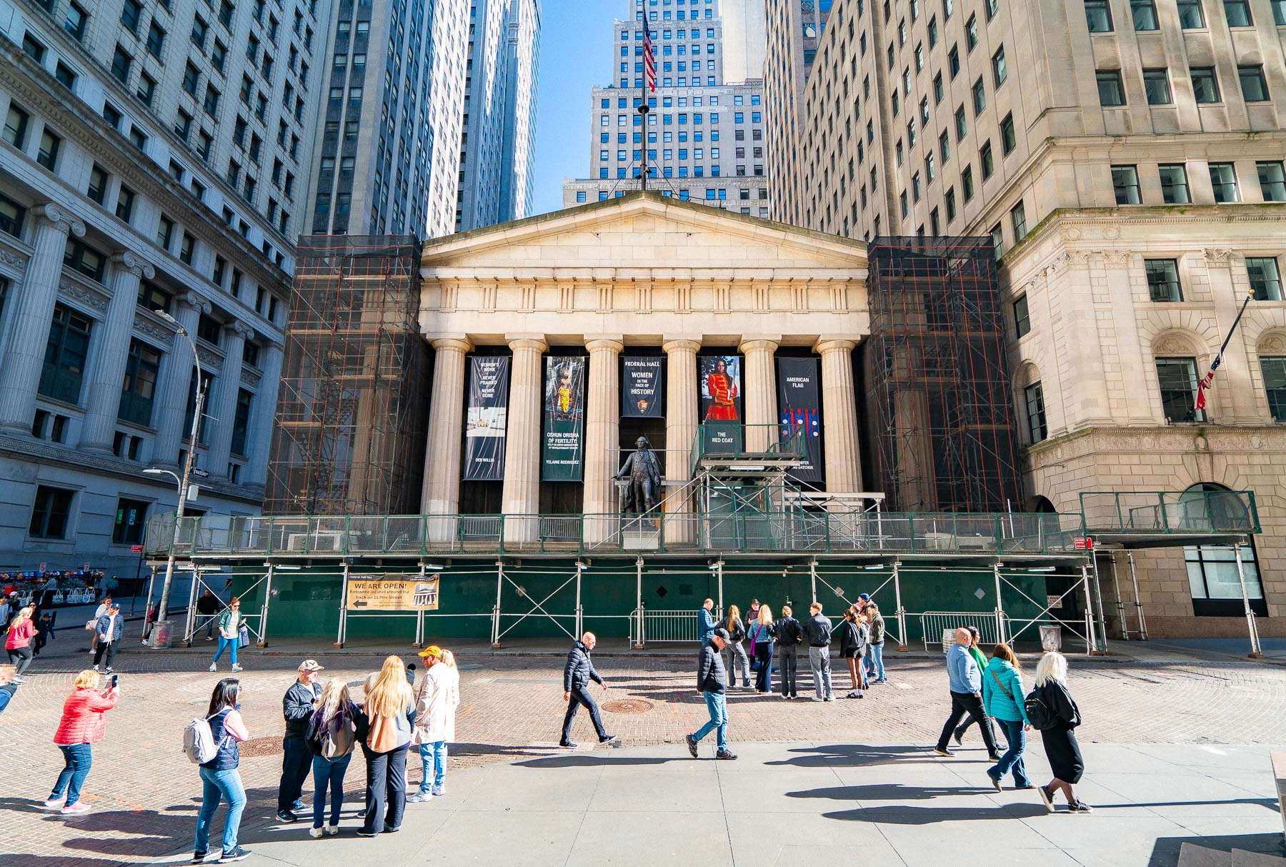 Tourists gather outside Federal Hall on Wall Street in Lower Manhattan.