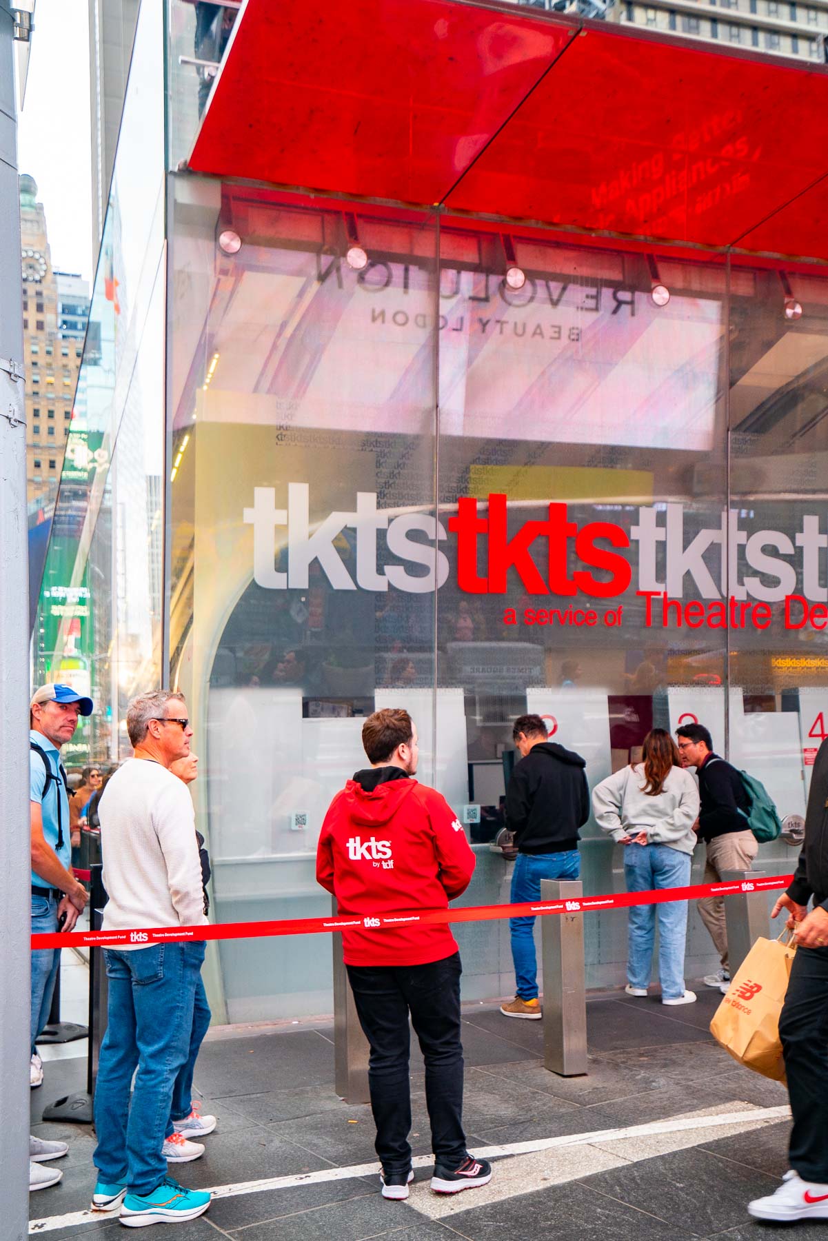 People line up outside the TKTS ticket booth in Times Square.