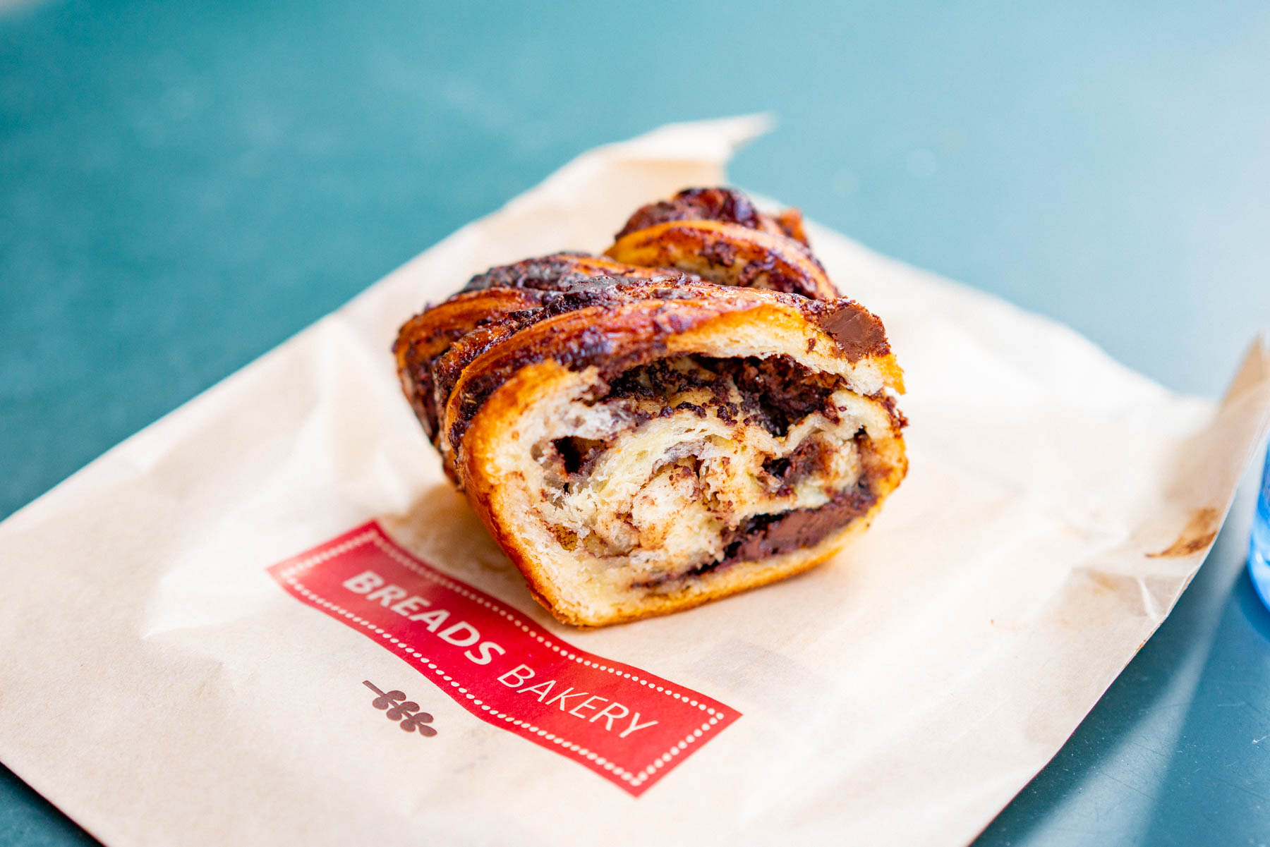 Babka from Bread's Bakery cut in half with chocolate pockets ribboned into the dough as one of the Best desserts NYC