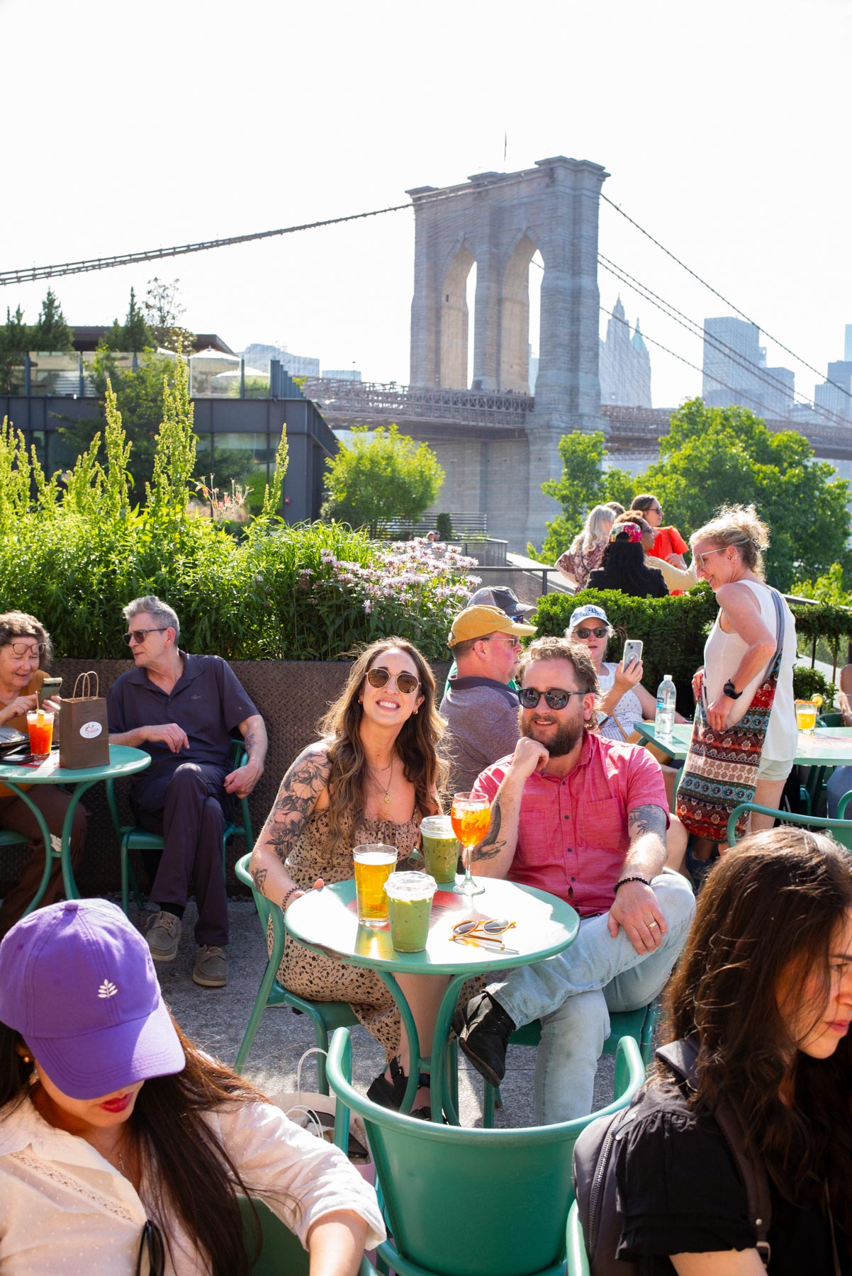 Communal seating and food stalls inside the Time Out Market food hall in DUMBO Brooklyn