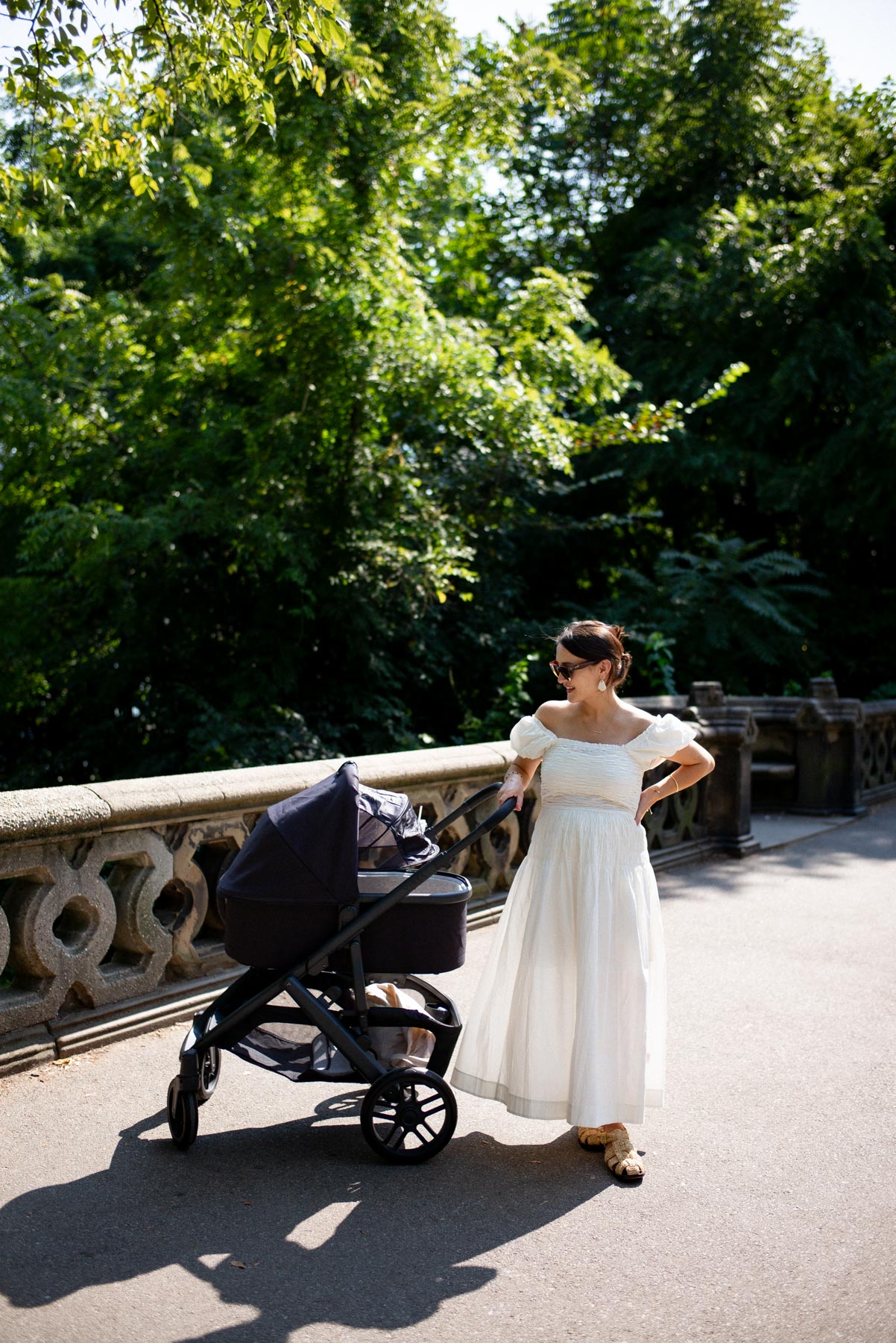 Woman with an infant in a stroller in Central Park