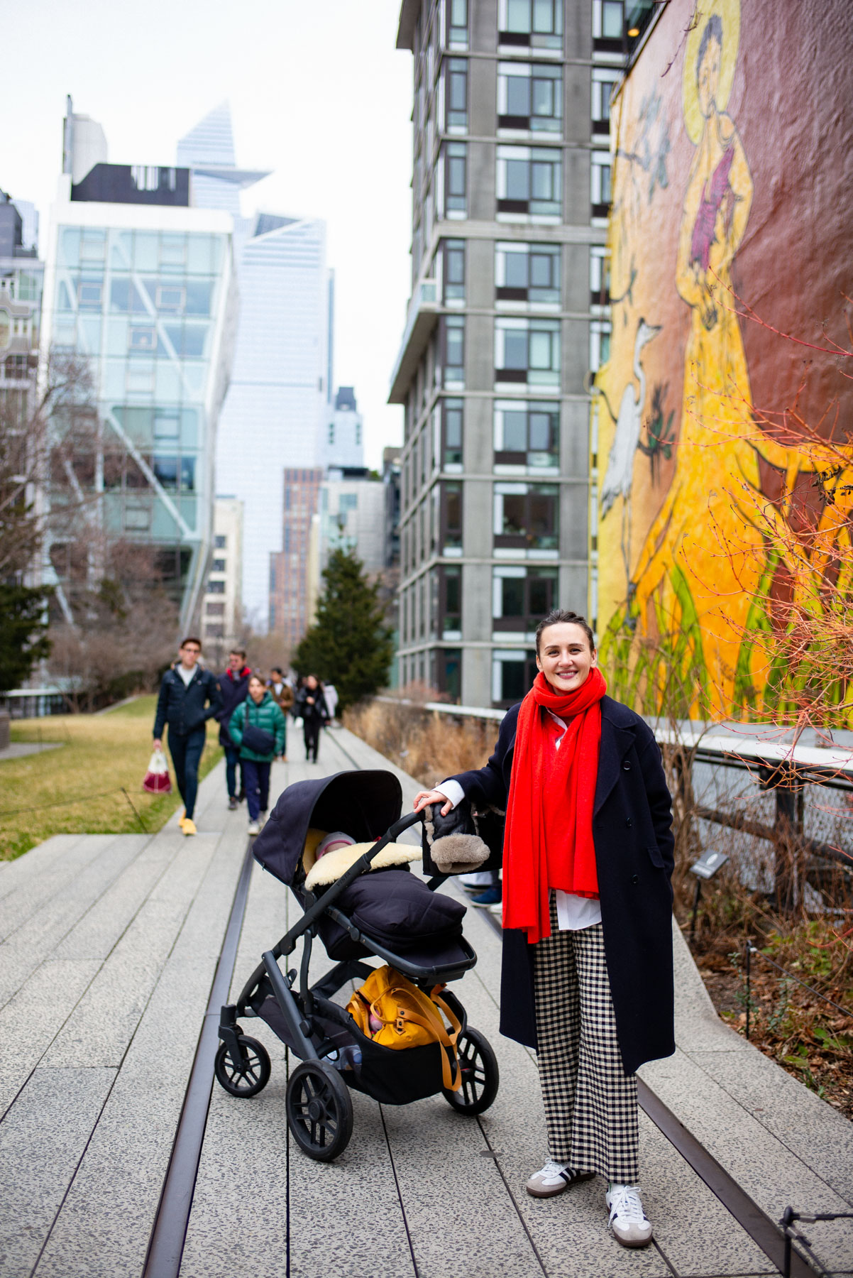 Mom pushing stroller on the High Line Park in New York City