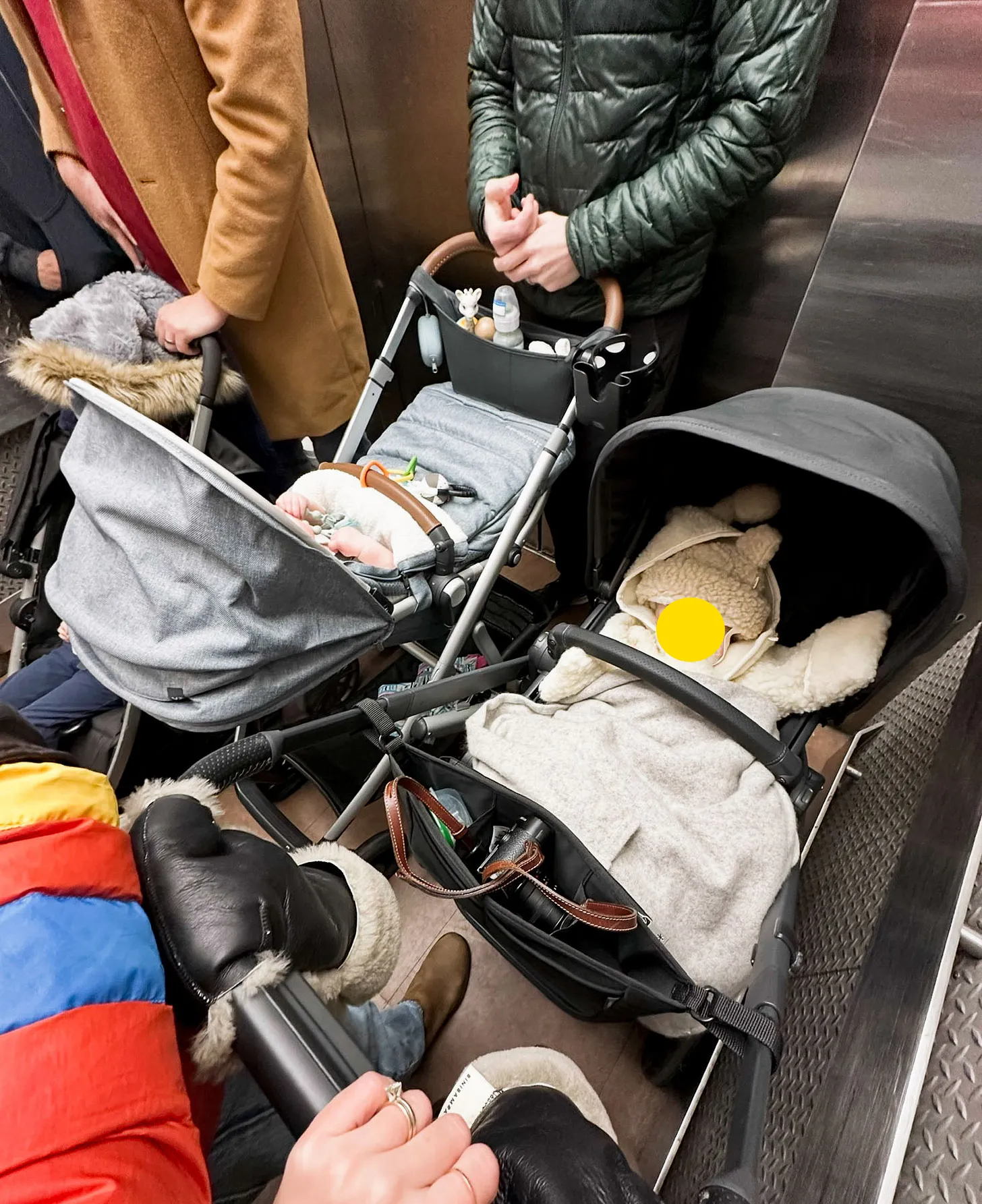 strollers in an elevator in NYC